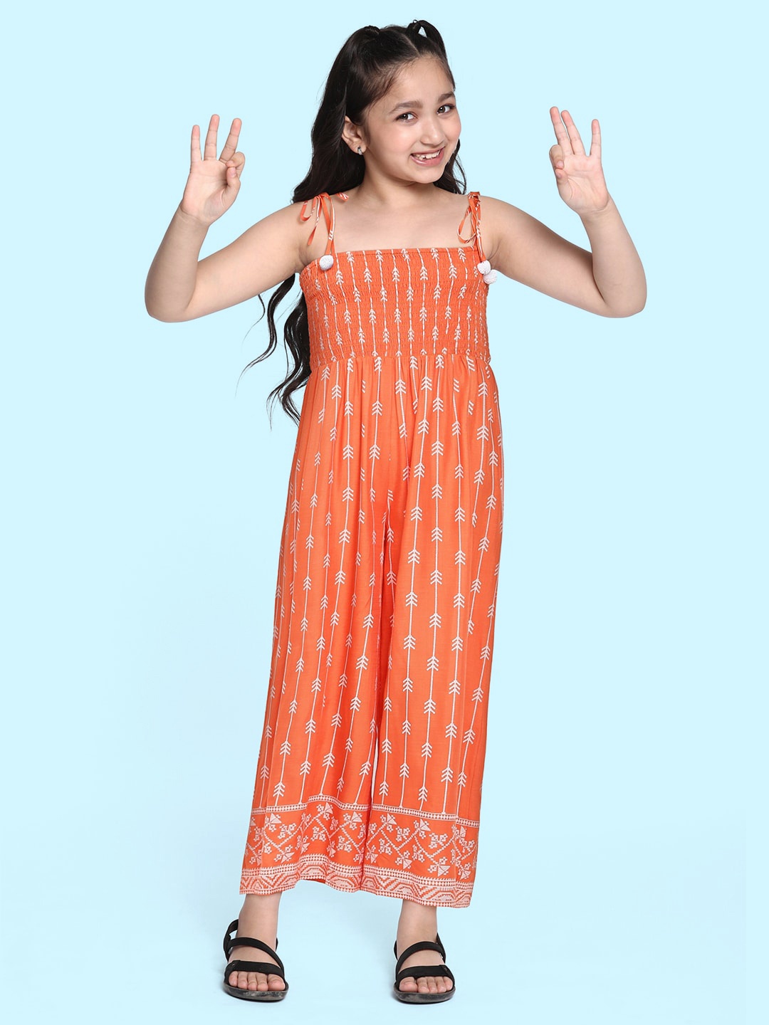 

Global Desi Girls Orange Printed Basic Jumpsuit