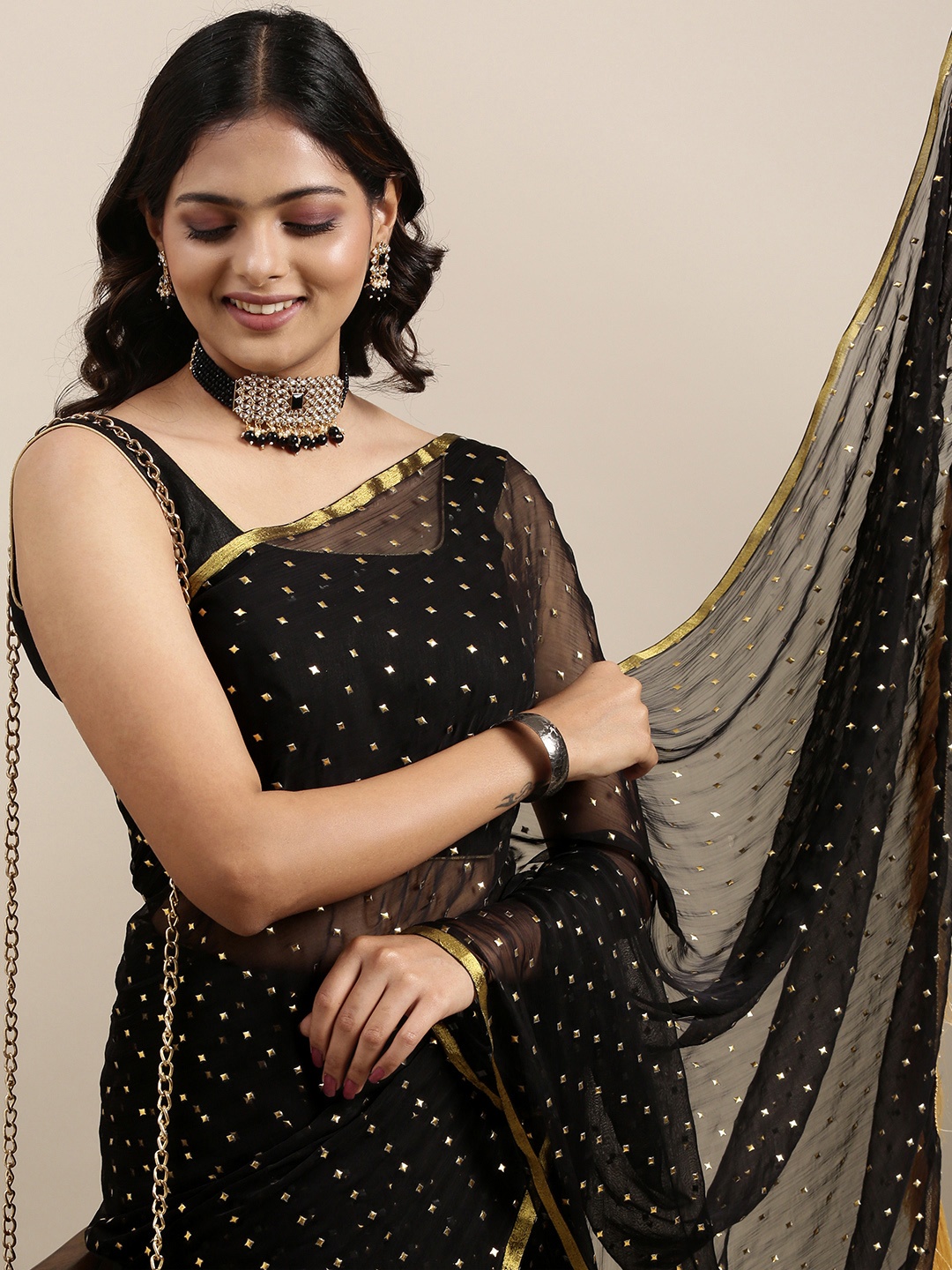 

Mitera Women Black & Golden Embellished Sequined Printed Saree