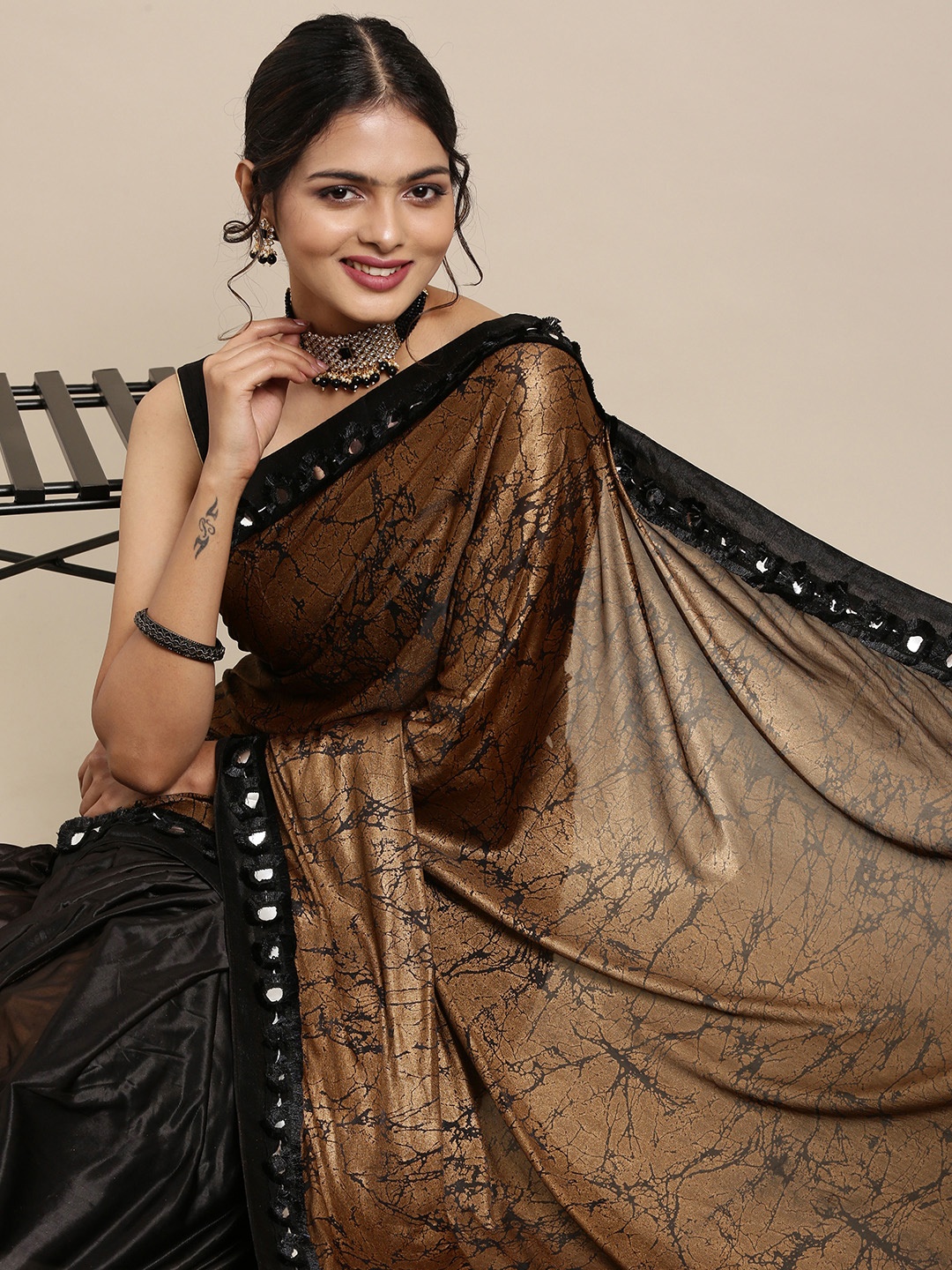 

Mitera Black & Brown Solid Sequinned Pure Georgette Saree