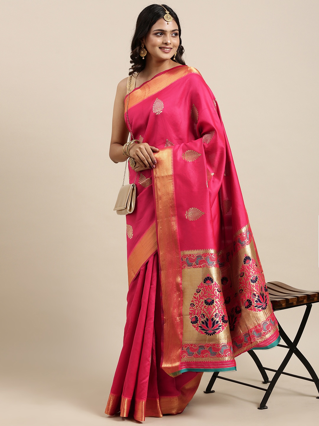 

Mitera Women Pink & Golden Ethnic Motifs Printed Saree