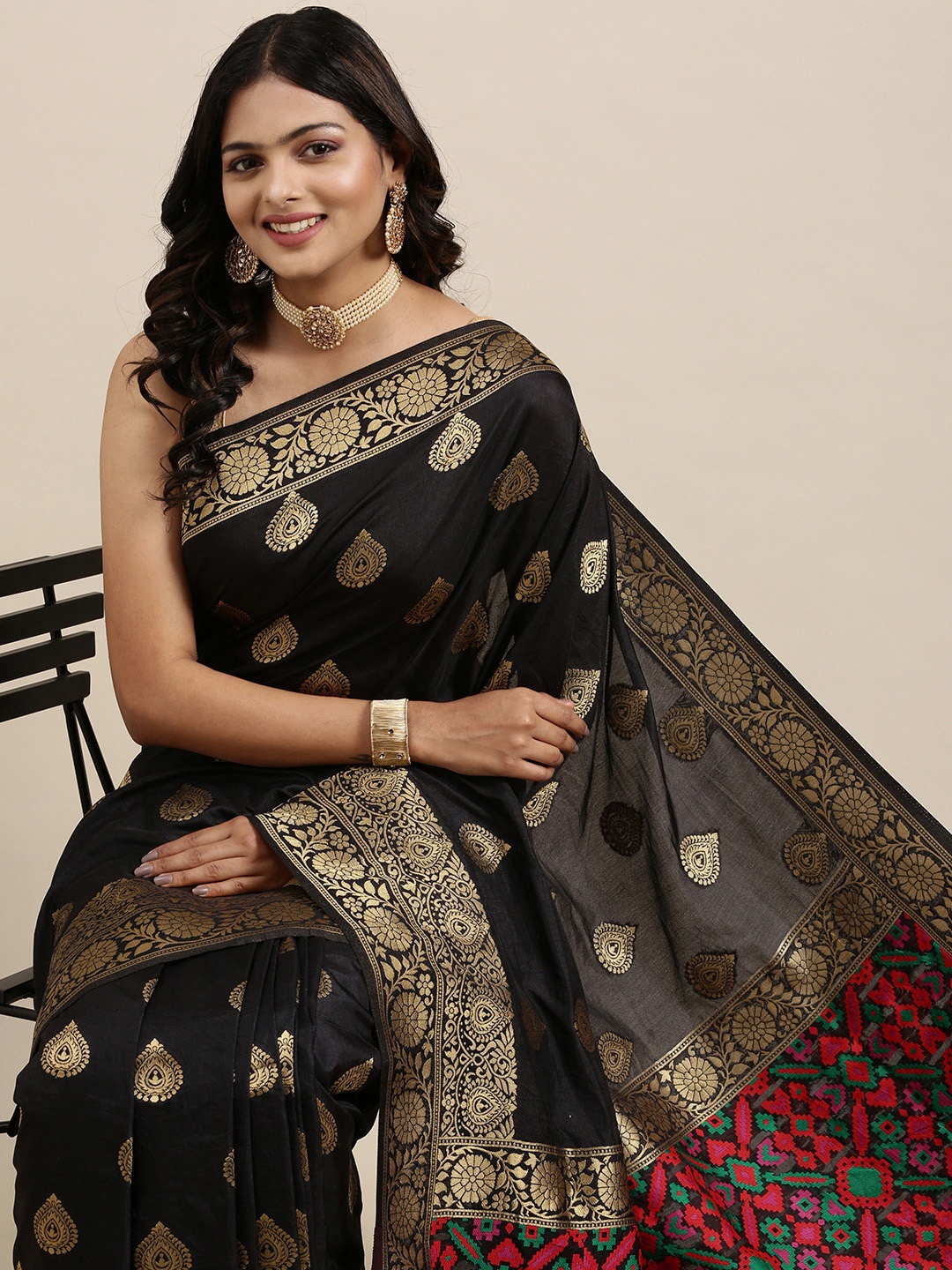 

Mitera Black & Golden Ethnic Woven Design Pure Georgette Saree