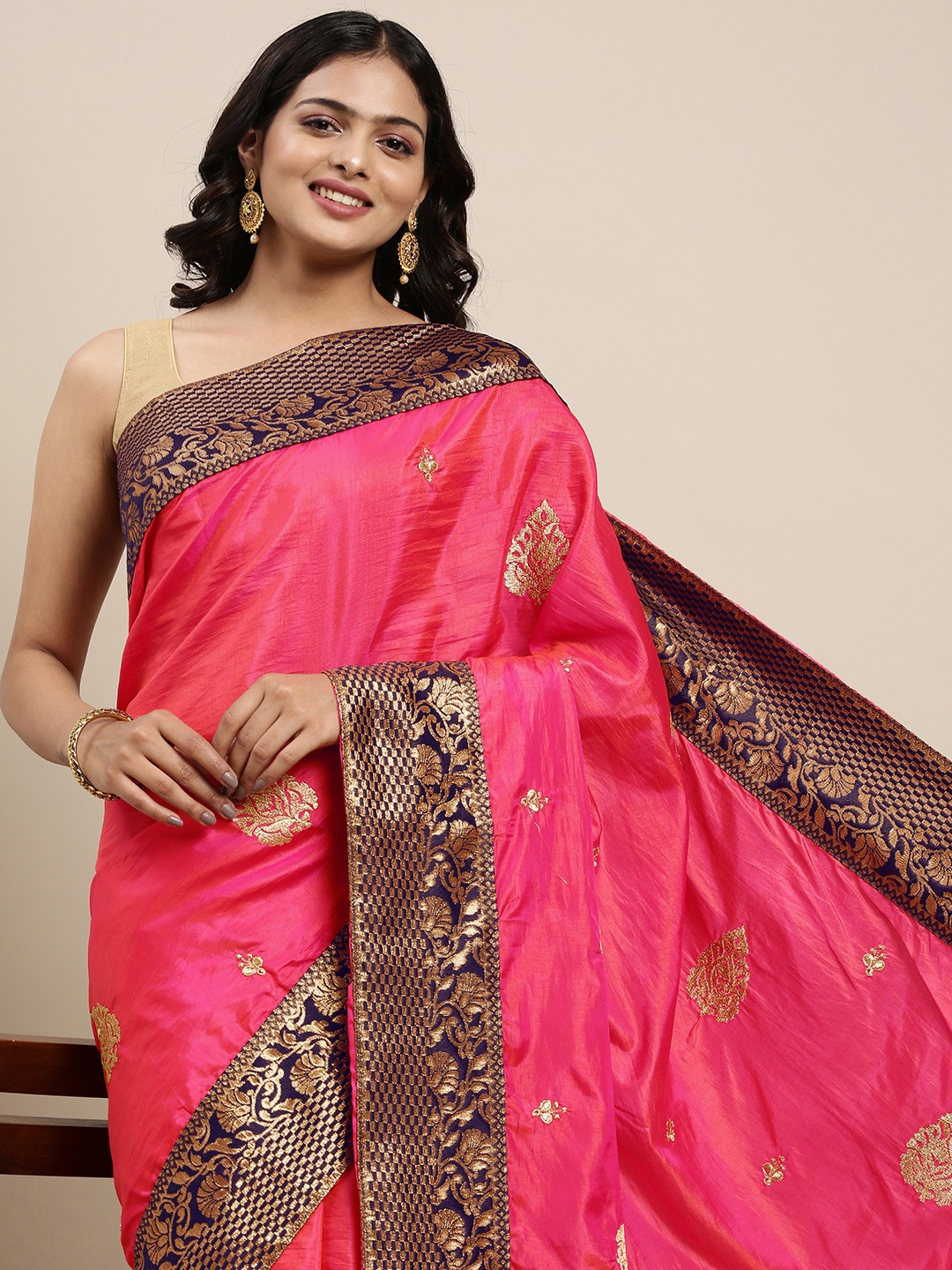 

Mitera Pink & Golden Ethnic Woven Design Pure Georgette Saree