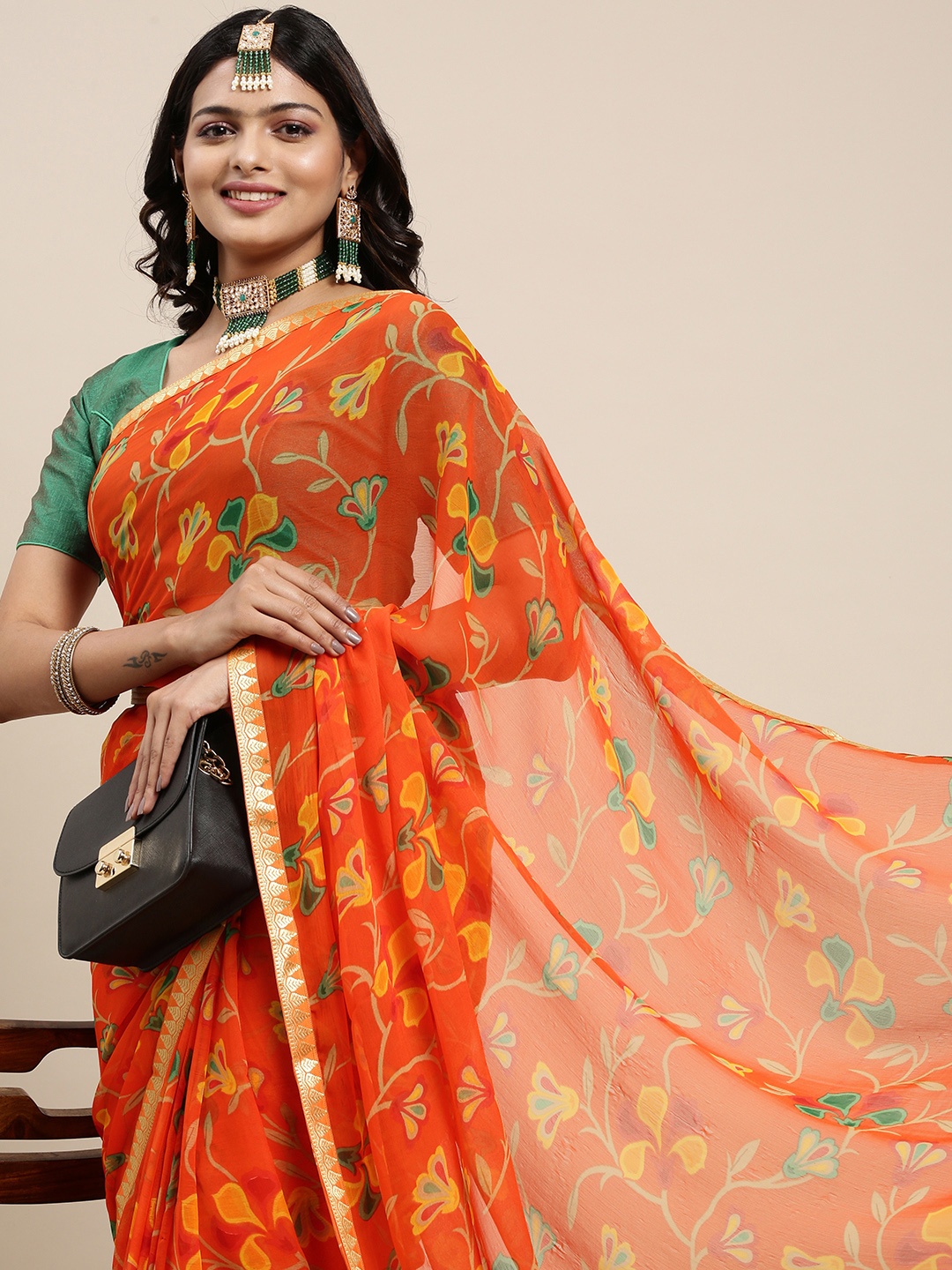 

Mitera Orange & Green Ethnic Printed Pure Georgette Saree