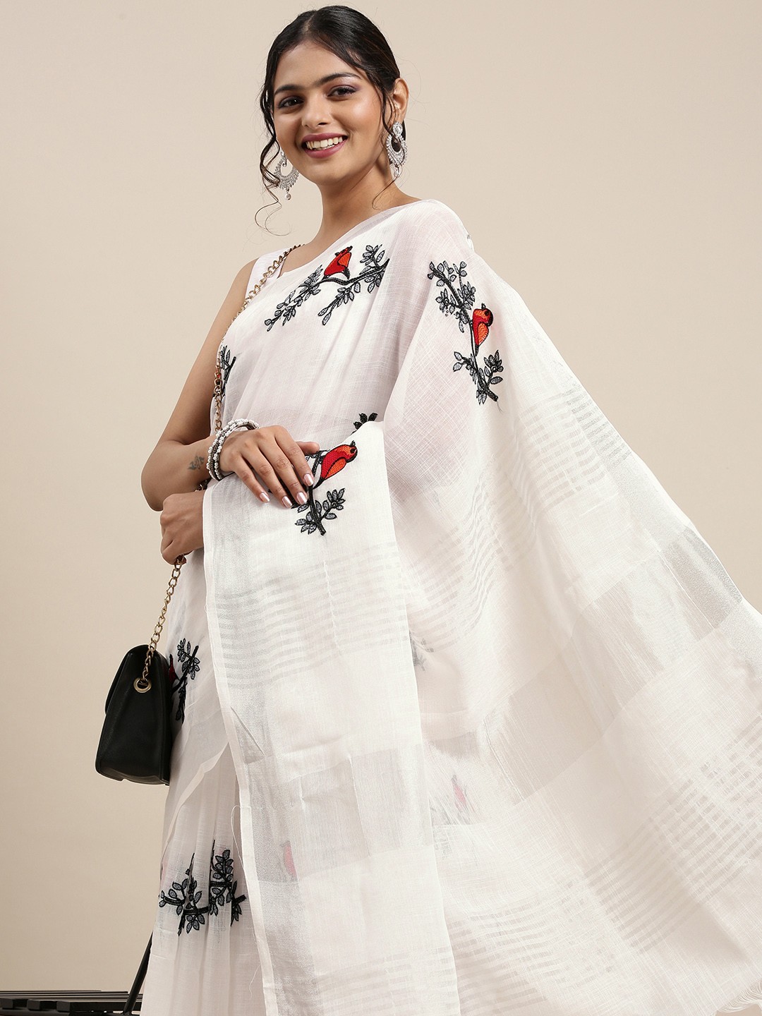 

Mitera Off White & Black Ethnic Motifs Embroidered Pure Georgette Saree