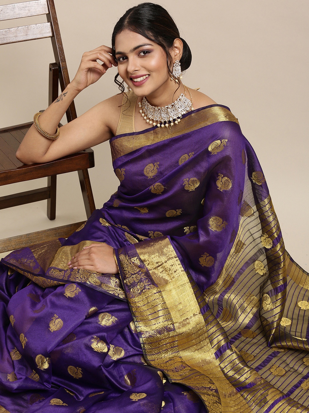 

Mitera Purple & Golden Ethnic Woven Design Pure Georgette Saree