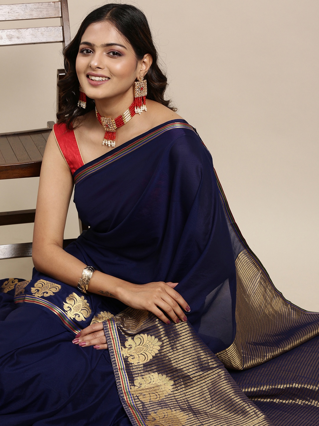 

Mitera Women Navy Blue & Golden Ethnic Motifs Printed Saree