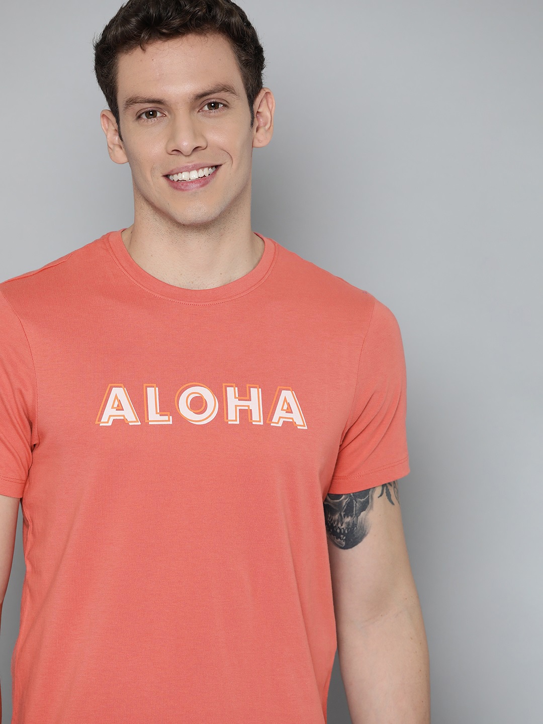 

Mast & Harbour Men Coral Red Typography Printed Pure Cotton T-shirt