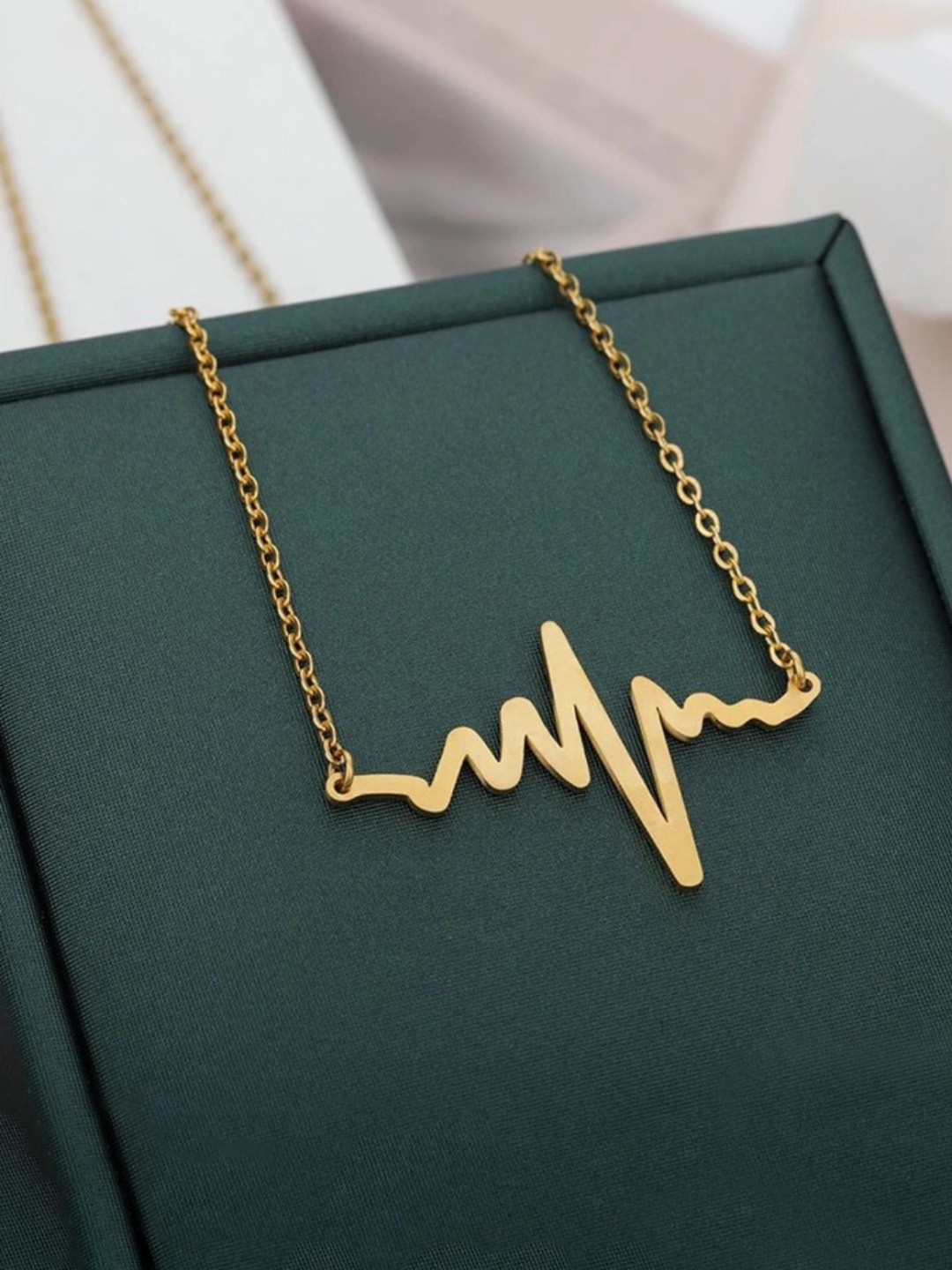 

Yellow Chimes Gold-Plated Heartbeat Pendant With Chain