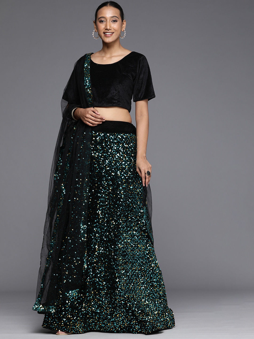 

Mitera Green & Black Velvet Semi-Stitched Lehenga & Unstitched Blouse With Dupatta
