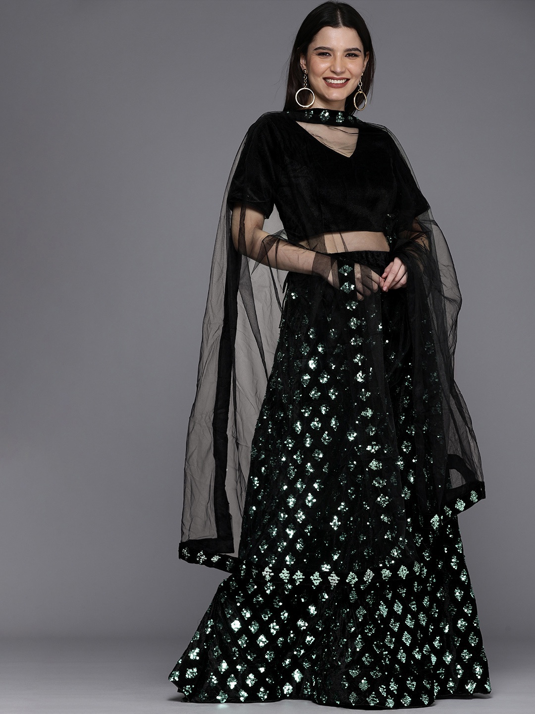 

Mitera Green & Black Velvet Semi-Stitched Lehenga & Unstitched Blouse With Dupatta