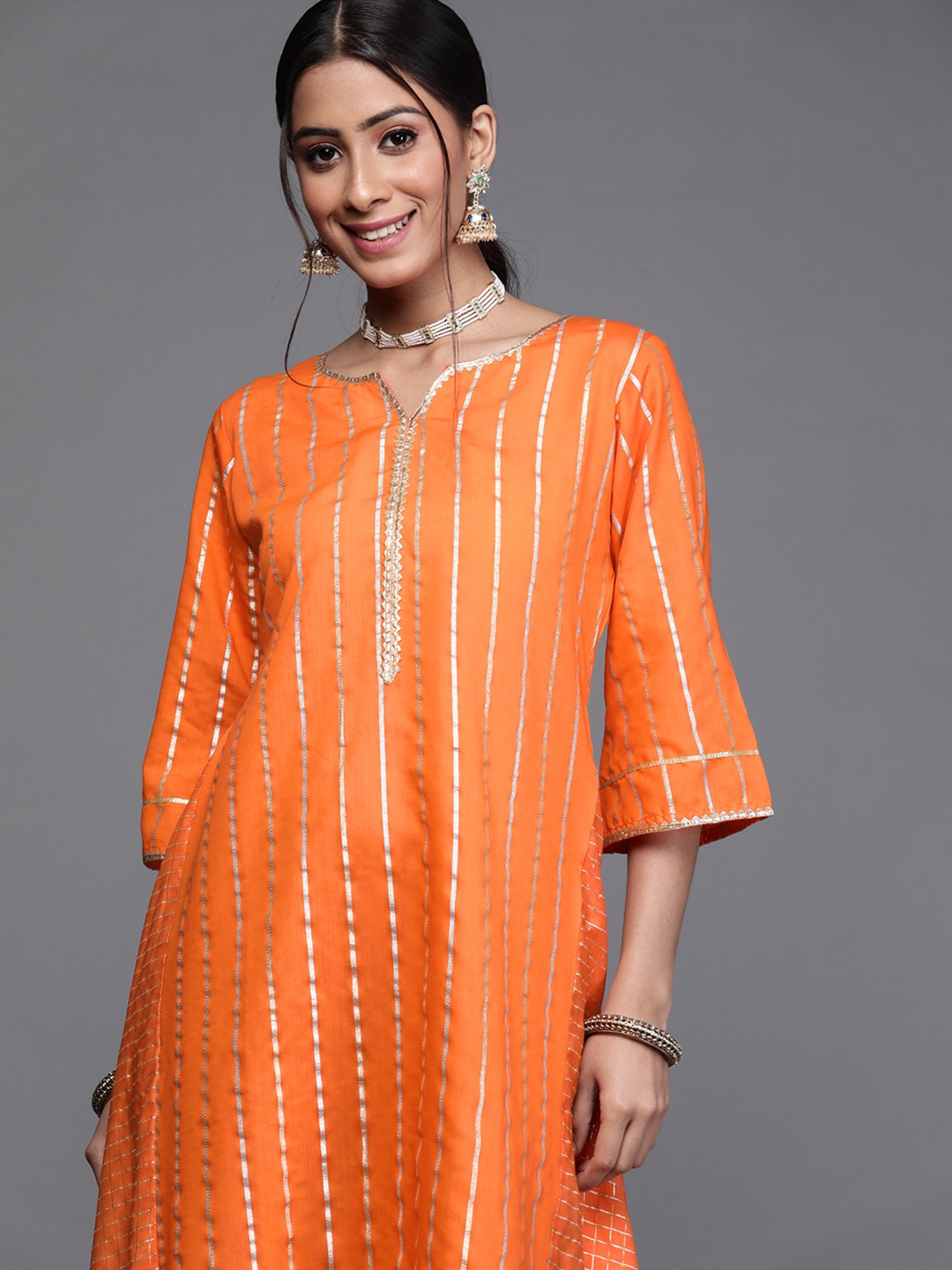

Libas Women Orange & Gold-Toned Striped Woven Design Gotta Patti Chanderi Silk Kurta
