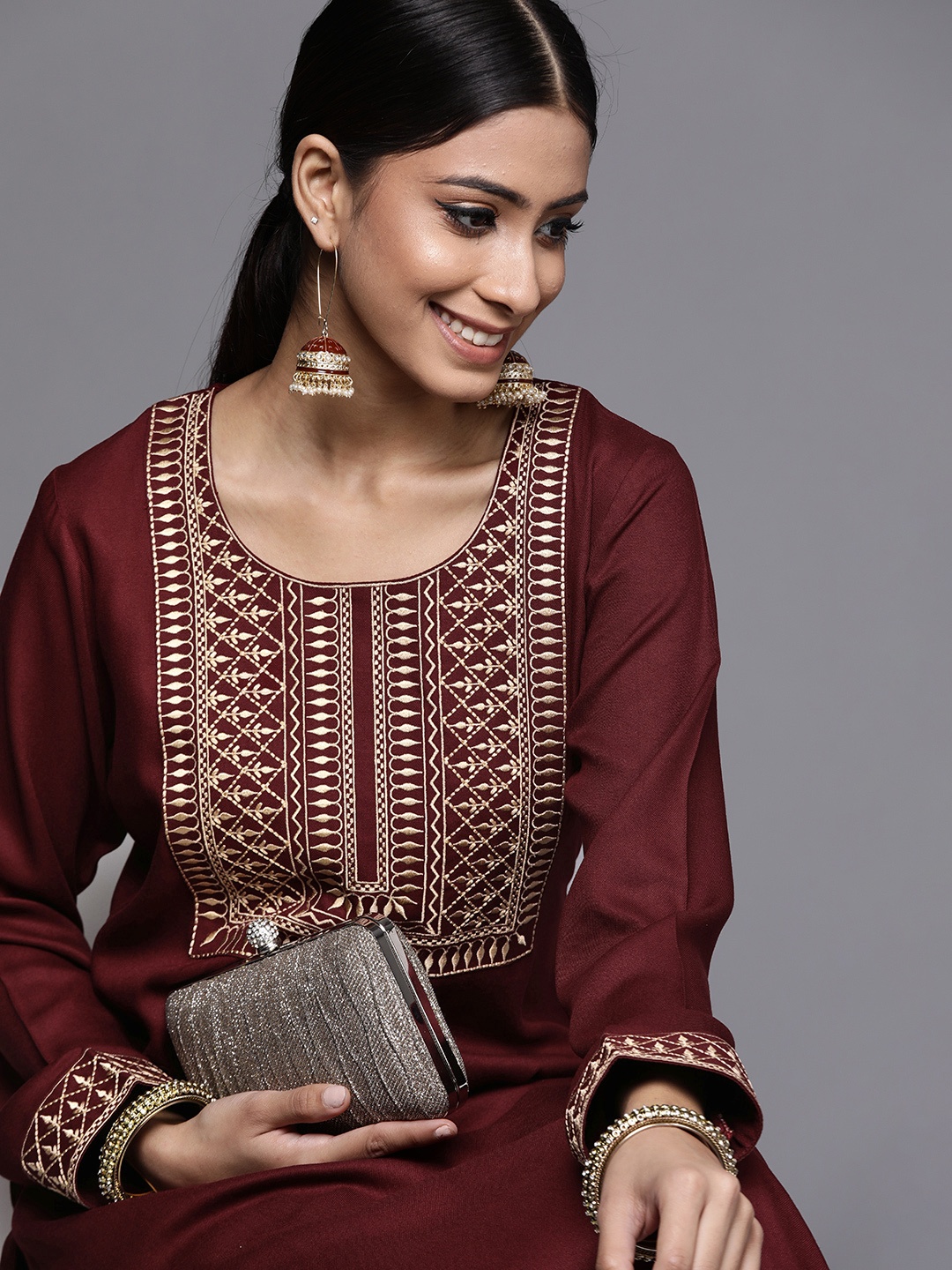

Libas Women Maroon & Golden Ethnic Motifs Yoke Design Pashmina Wool Kurta