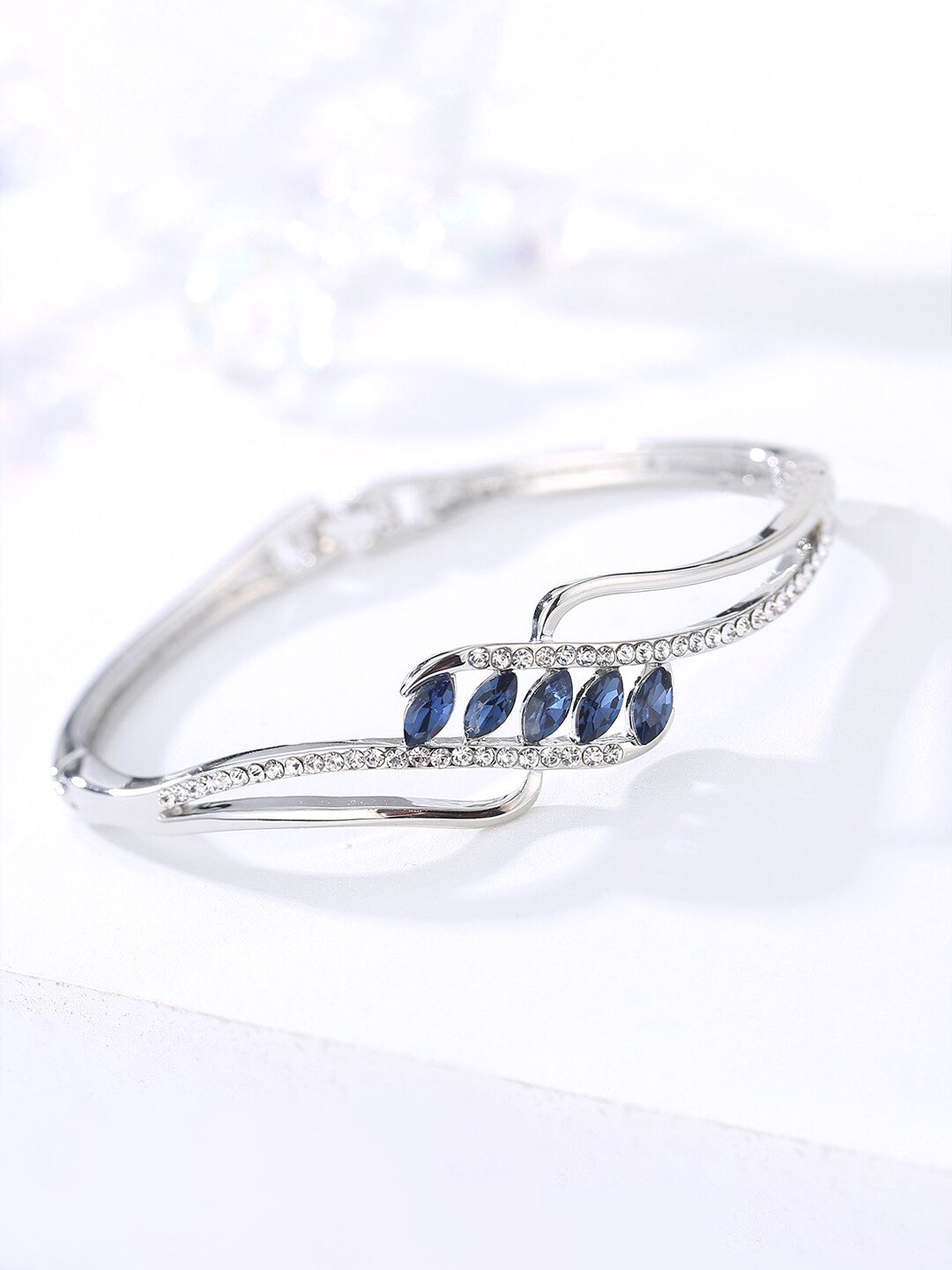 

Yellow Chimes Women Silver-Toned & Blue Sparkling Crystal Studded Kada Bracelet