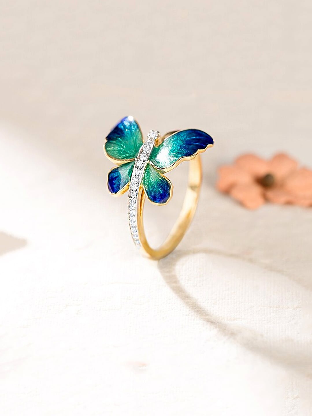 

Yellow Chimes Gold-Plated Blue & Green Crystals Studded Finger Ring