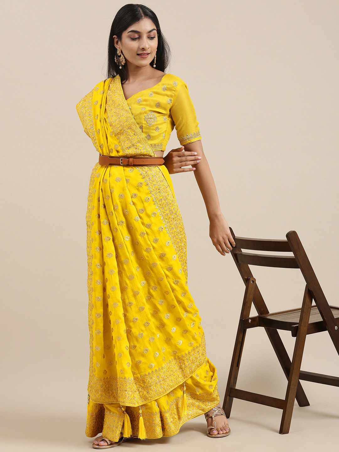 

Mitera Yellow Ethnic Motifs Beads and Stones Satin Saree