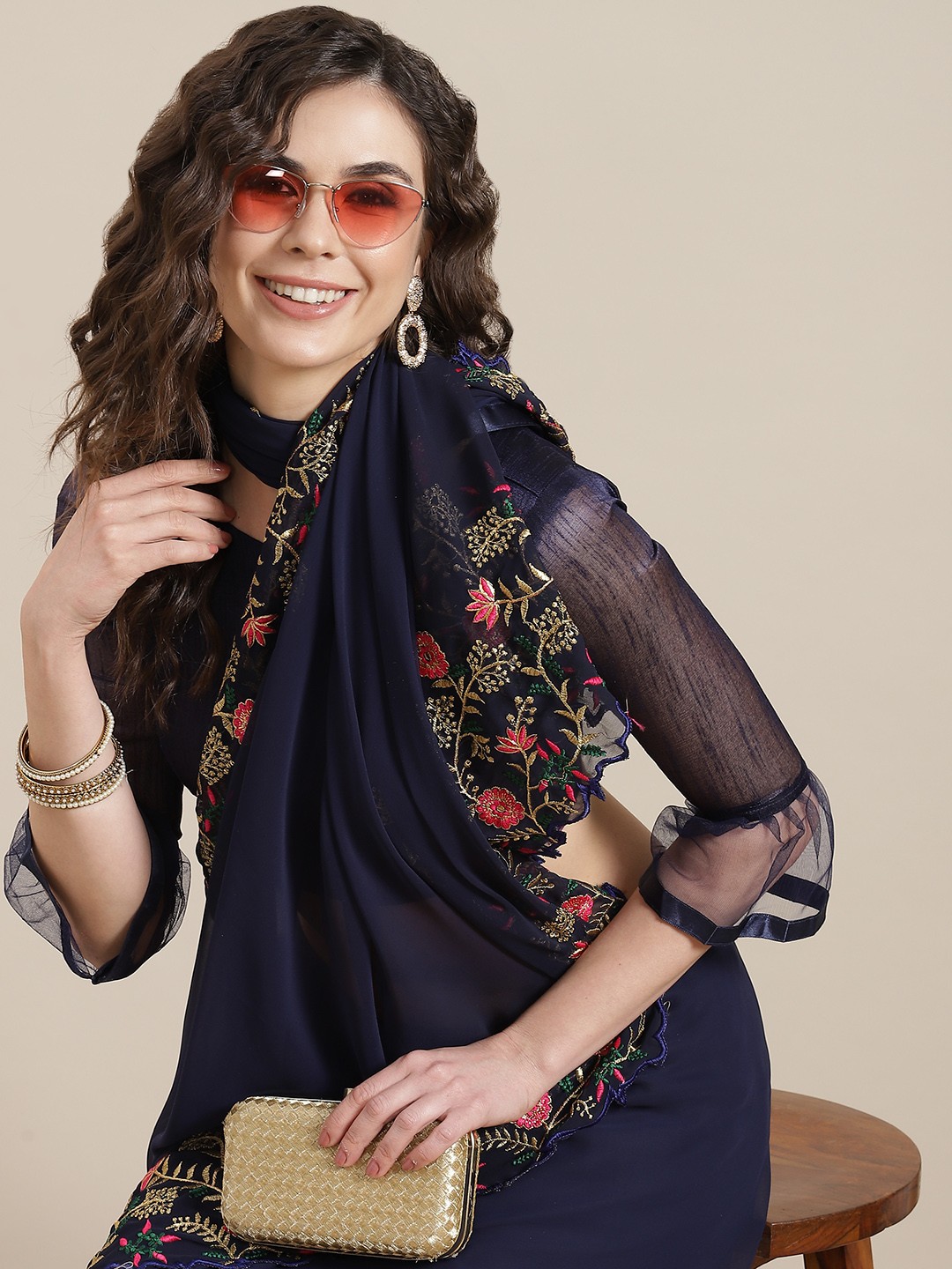 

Mitera Navy Blue Floral Embroidered Ruffle Design Saree