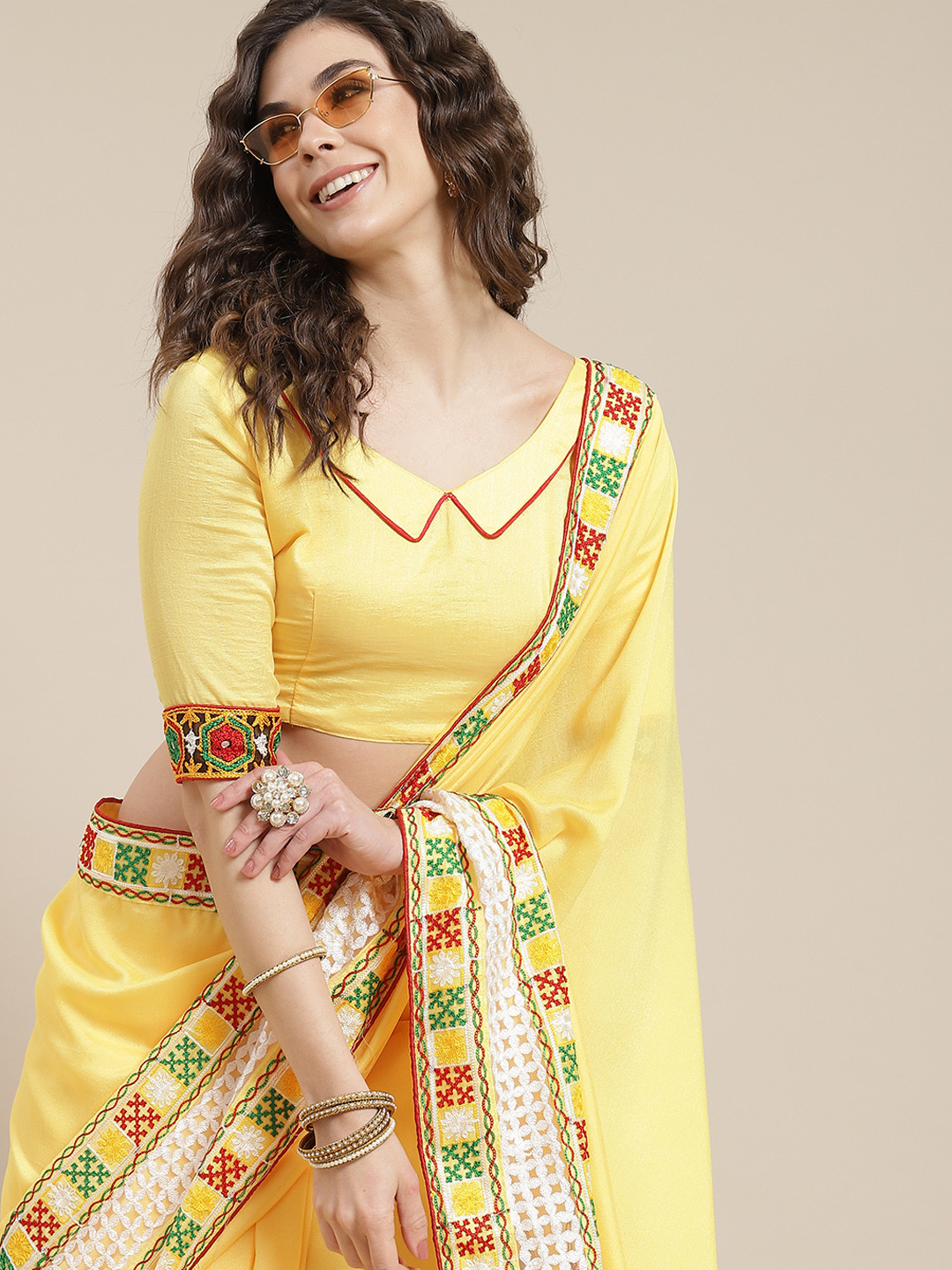 

Mitera Women Yellow & Red Solid Saree