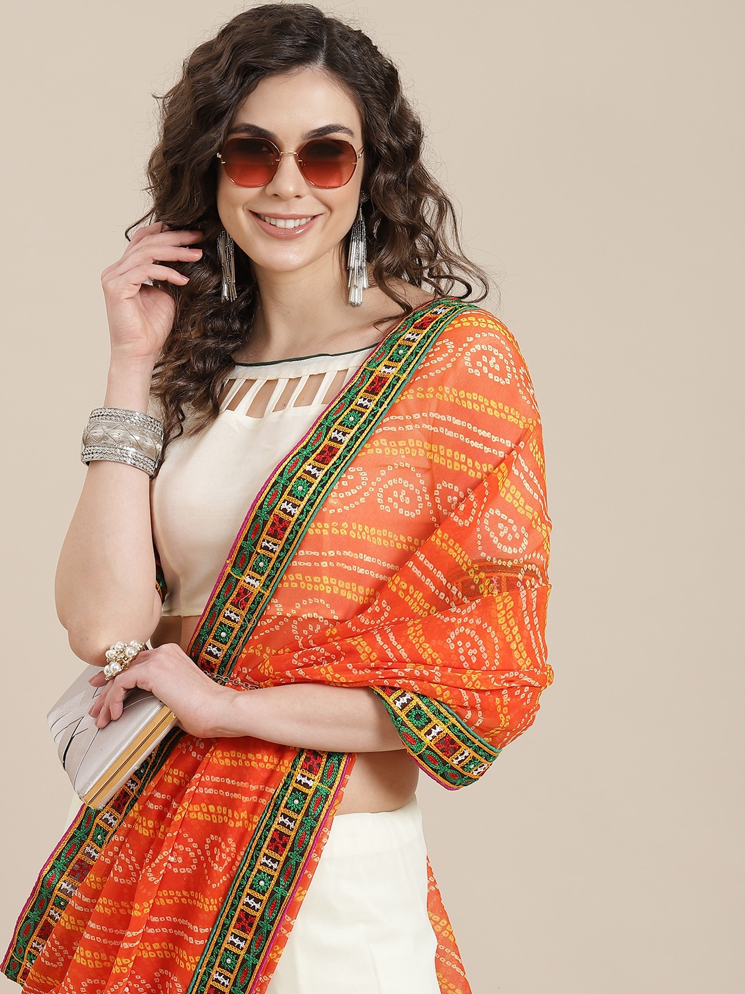 

Mitera White & Orange Bandhani Saree