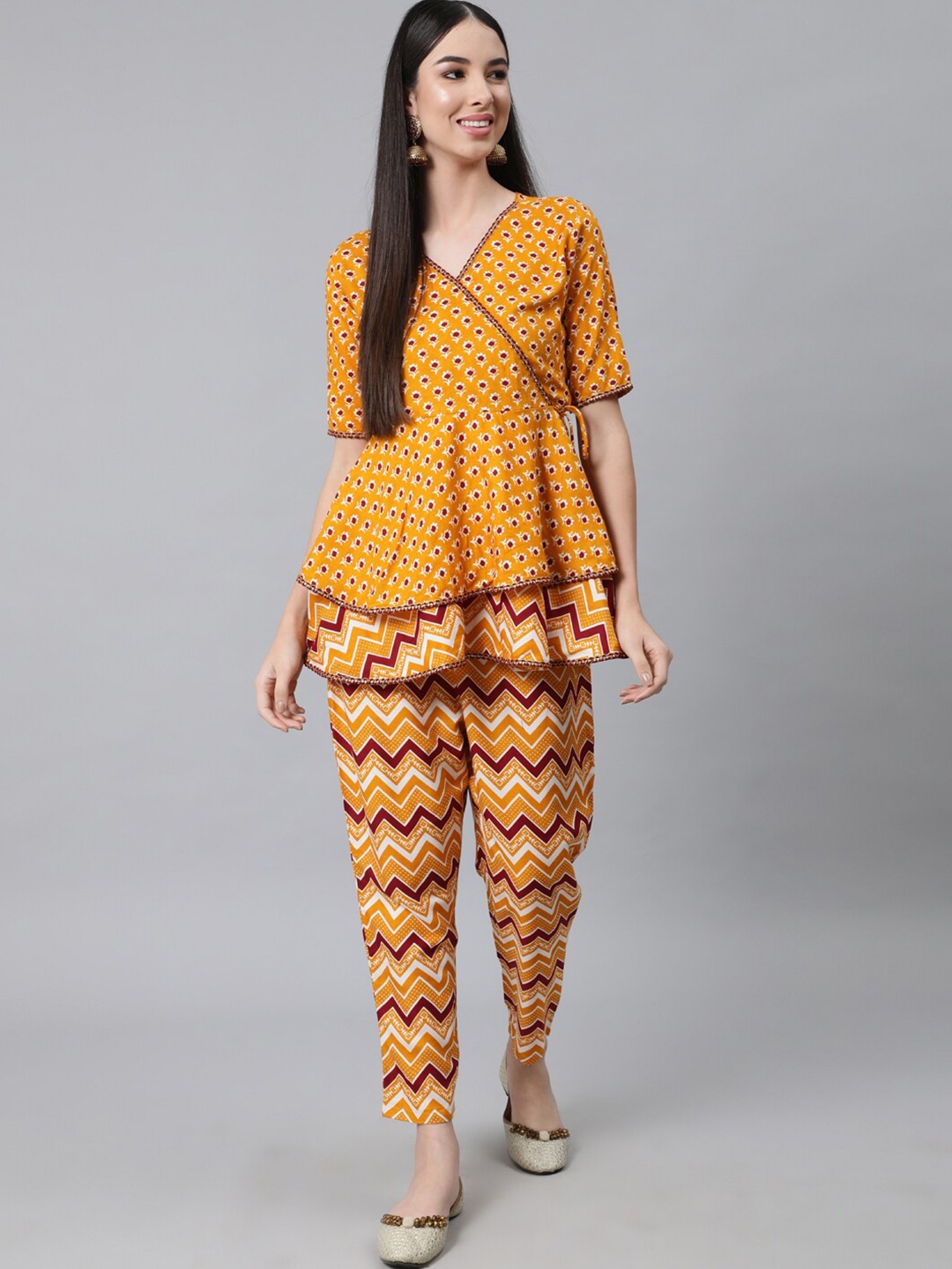 

Anubhutee Women Mustard Yellow Ethnic Motifs Printed Angrakha Gotta Patti Pure Cotton Kurti with Trousers