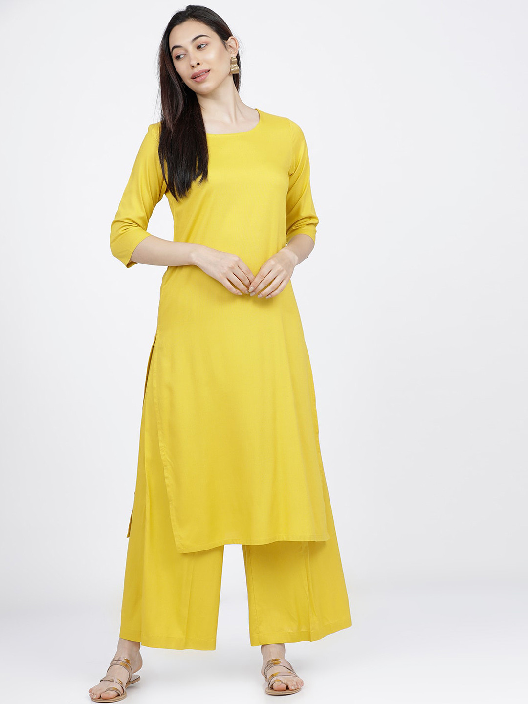 

Vishudh Women Mustard Yellow Solid Round Neck Straight Kurta