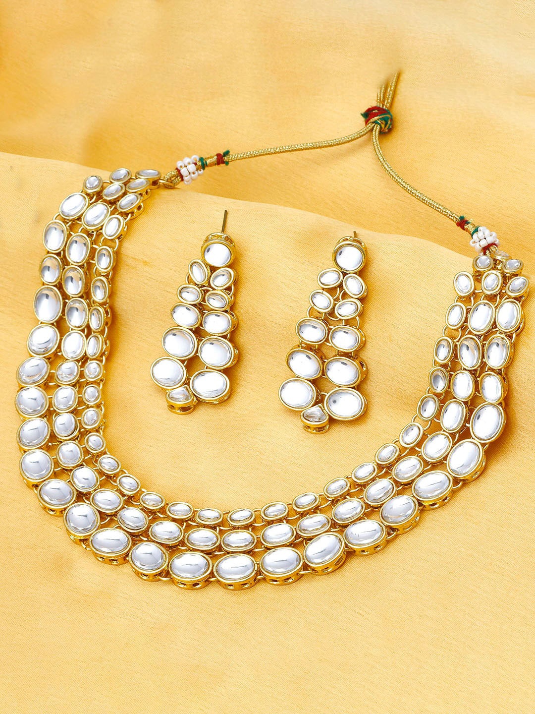 

Sukkhi Gold-Plated White Kundan-Studded Jewellery Set