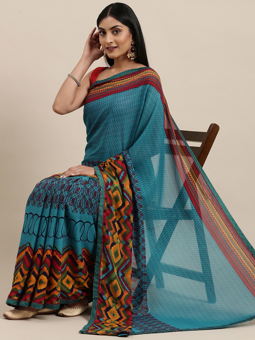 

Triveni Blue Printed Pure Georgette Saree