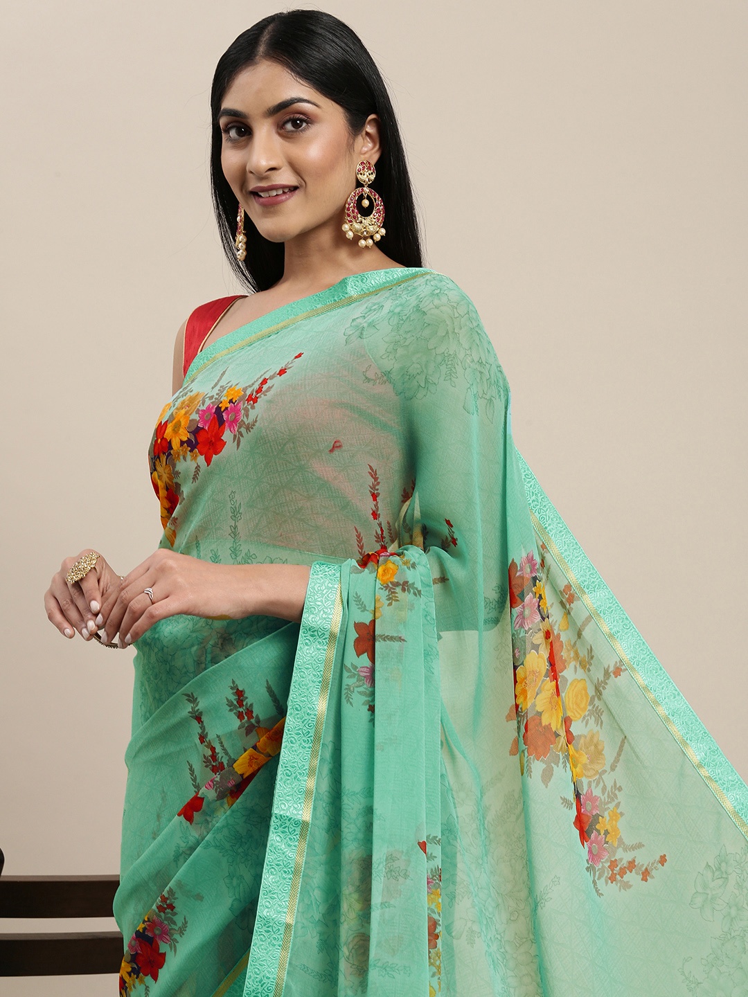 

Triveni Sea Green Floral Pure Georgette Saree