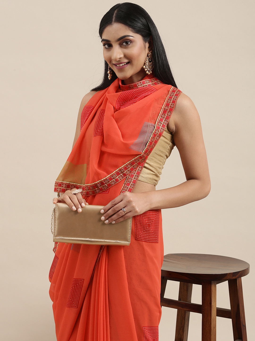 

Triveni Orange Printed Saree