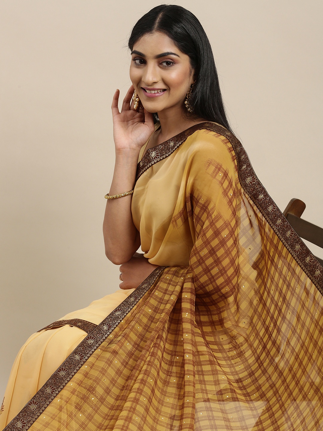 

Triveni Peach-Coloured Pure Georgette Saree