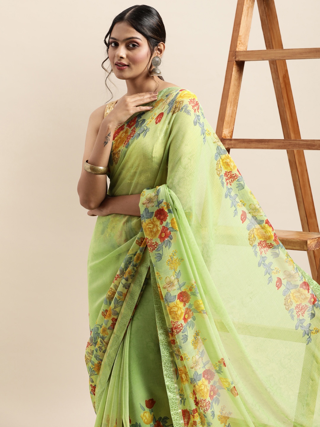 

Triveni Green Printed Pure Georgette Saree