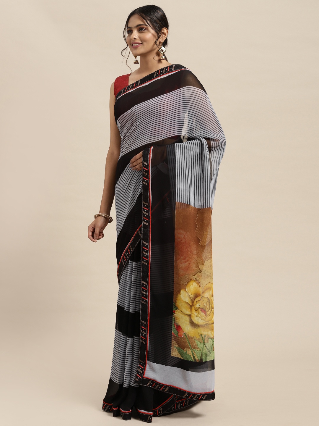 

Triveni Black Striped Pure Georgette Saree