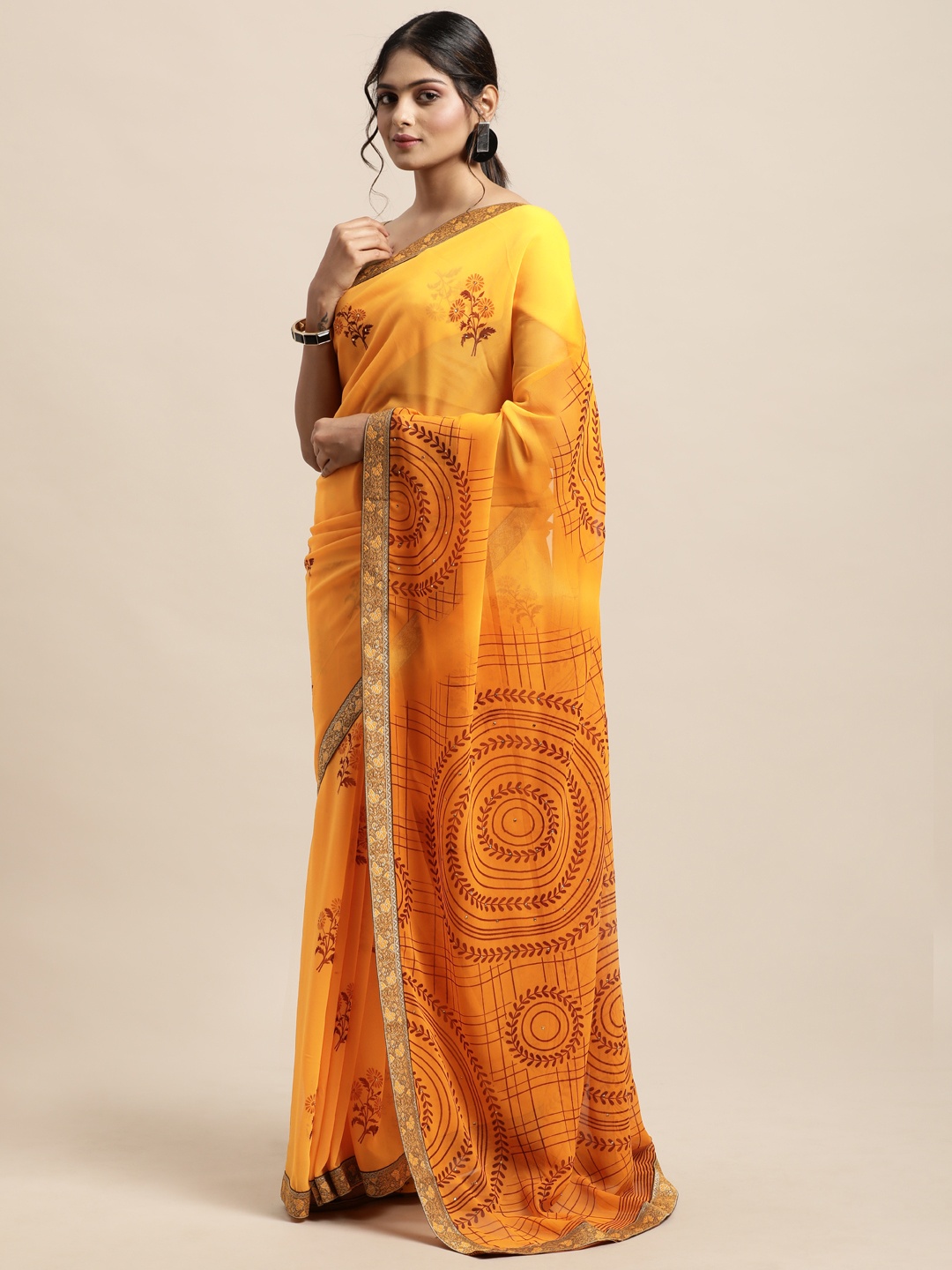 

Triveni Yellow Floral Beads and Stones Pure Georgette Saree