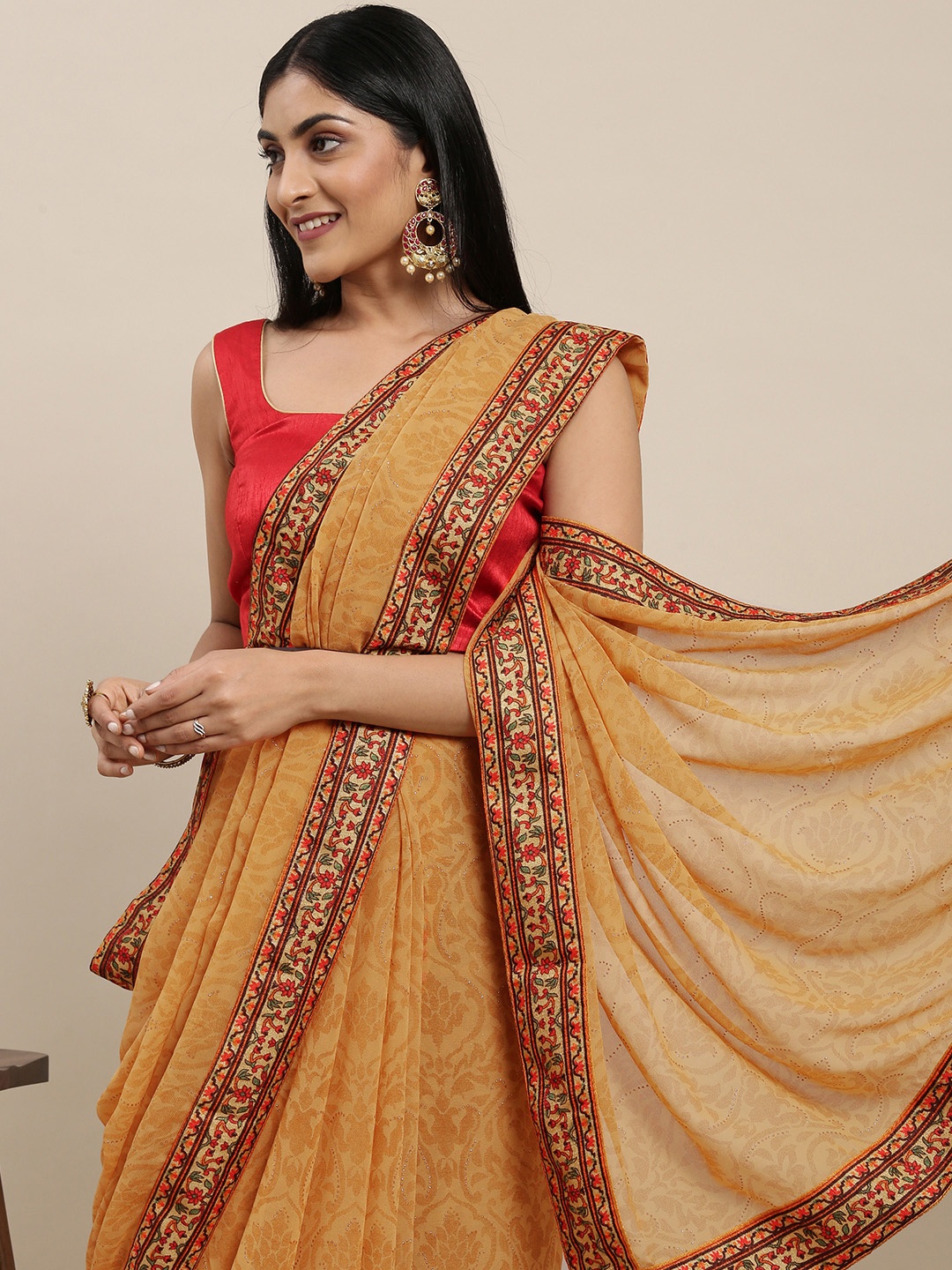 

Triveni Beige Ethnic Motifs Pure Georgette Saree