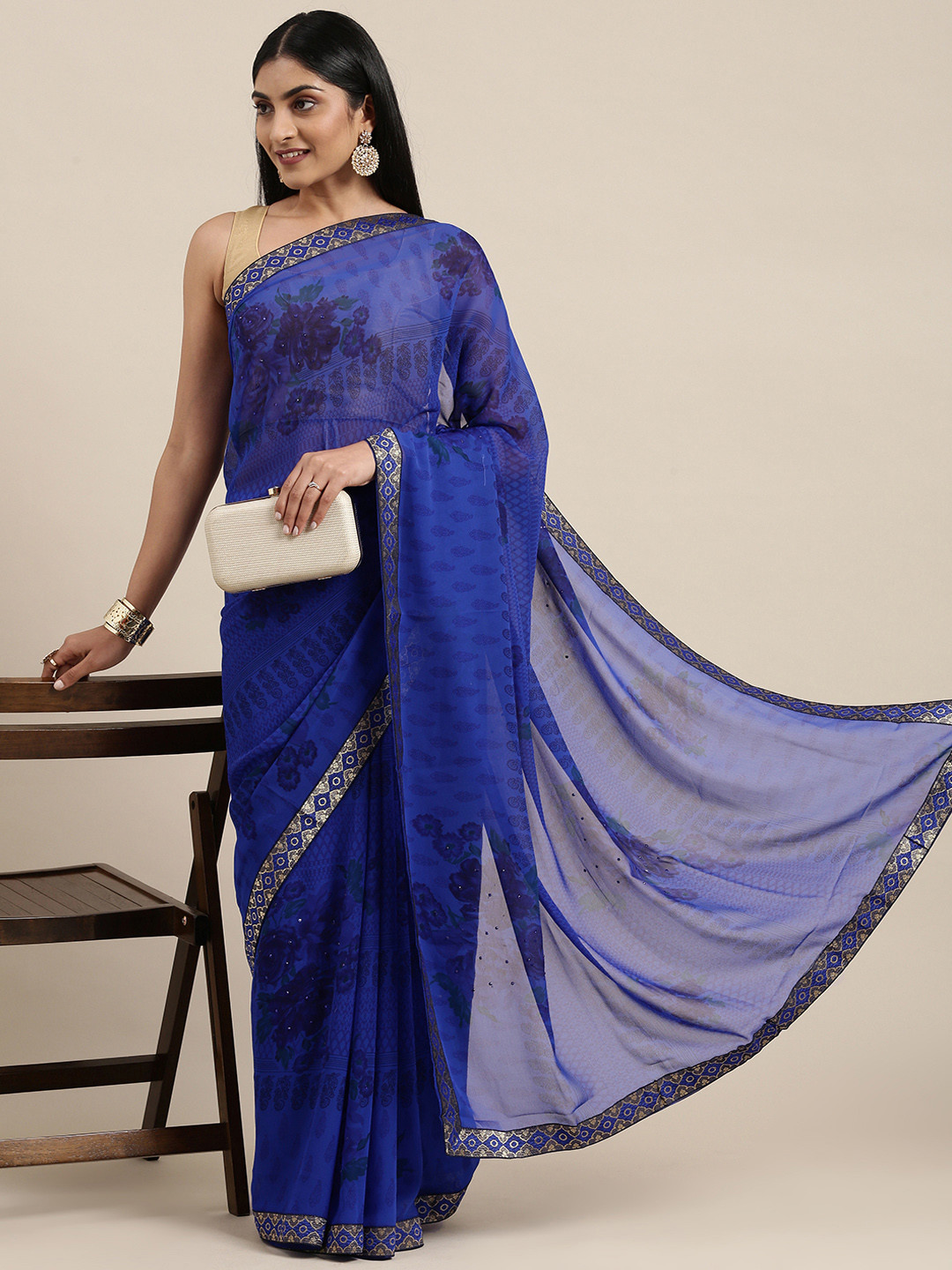 

Triveni Blue Floral Pure Georgette Saree