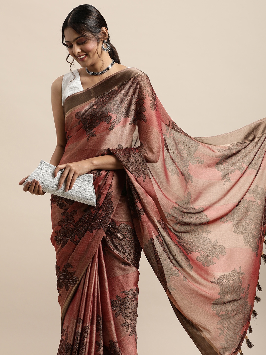 

Triveni Brown Floral Beads and Stones Saree