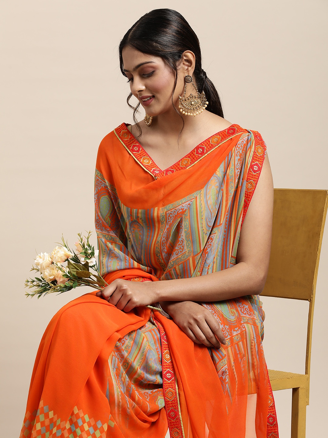 

Triveni Orange Printed Poly Georgette Saree