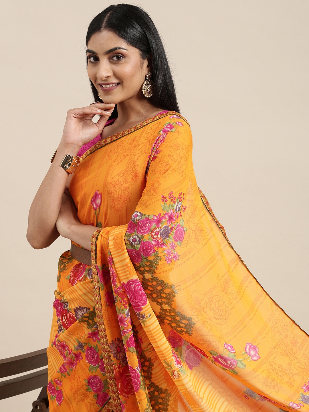 

Triveni Yellow Floral Pure Georgette Saree