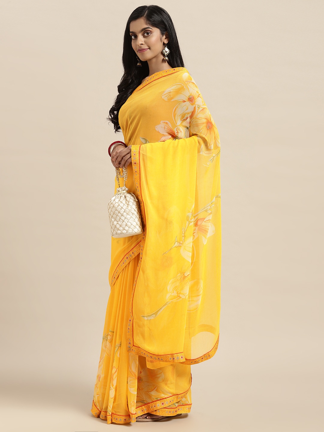 

Triveni Mustard Yellow Floral Pure Georgette Saree