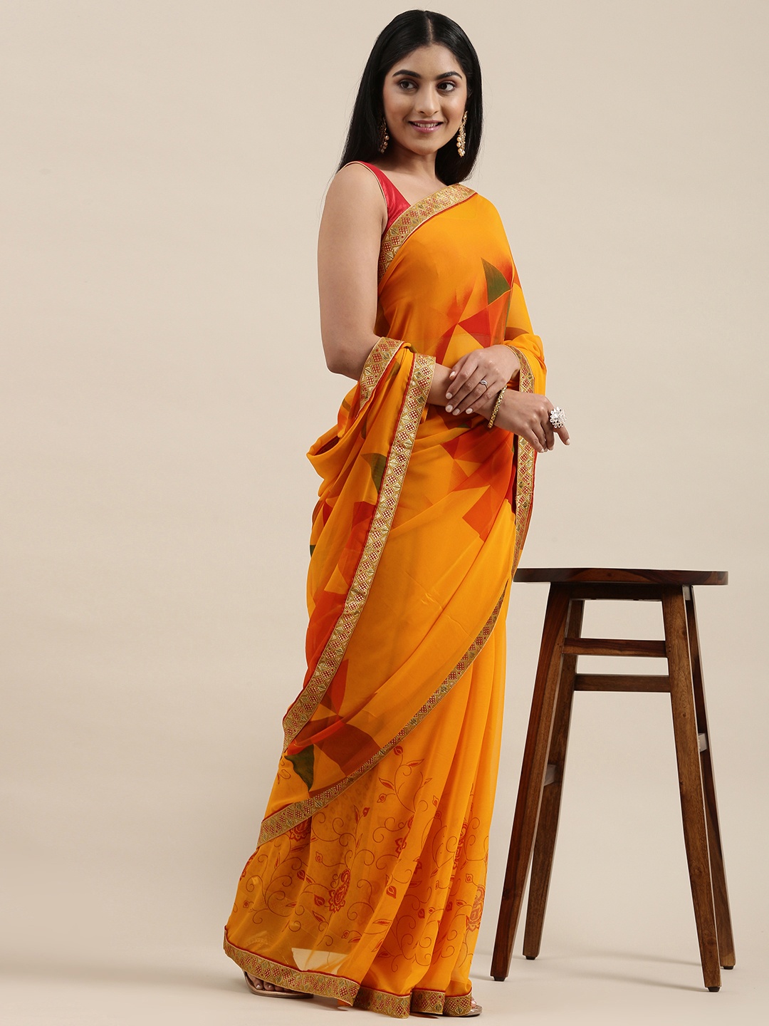 

Triveni Orange Printed Saree
