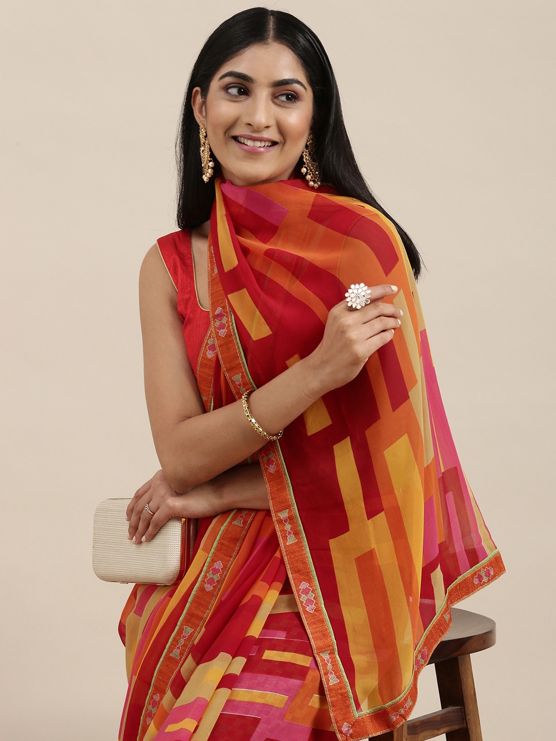

Triveni Red Printed Pure Georgette Saree