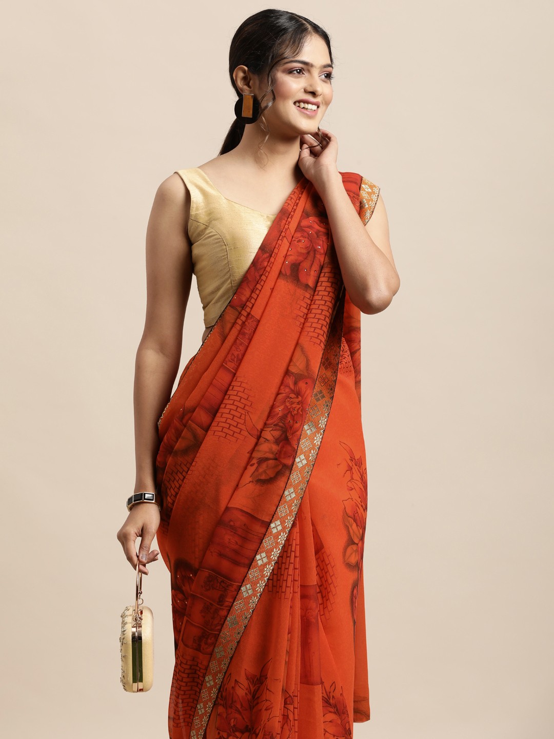 

Triveni Orange Floral Beads and Stones Pure Georgette Saree