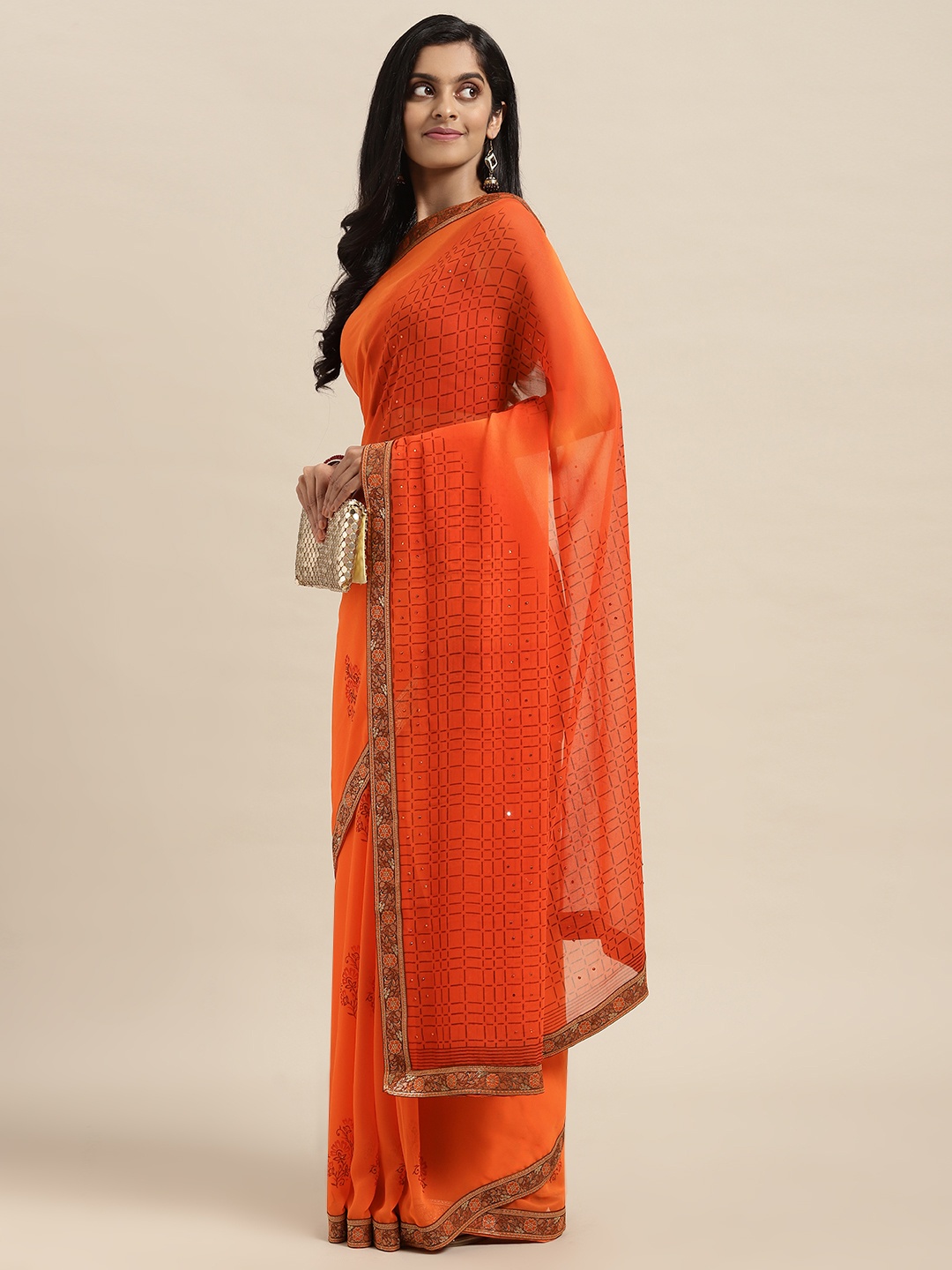 

Triveni Orange Floral Beads and Stones Pure Georgette Saree