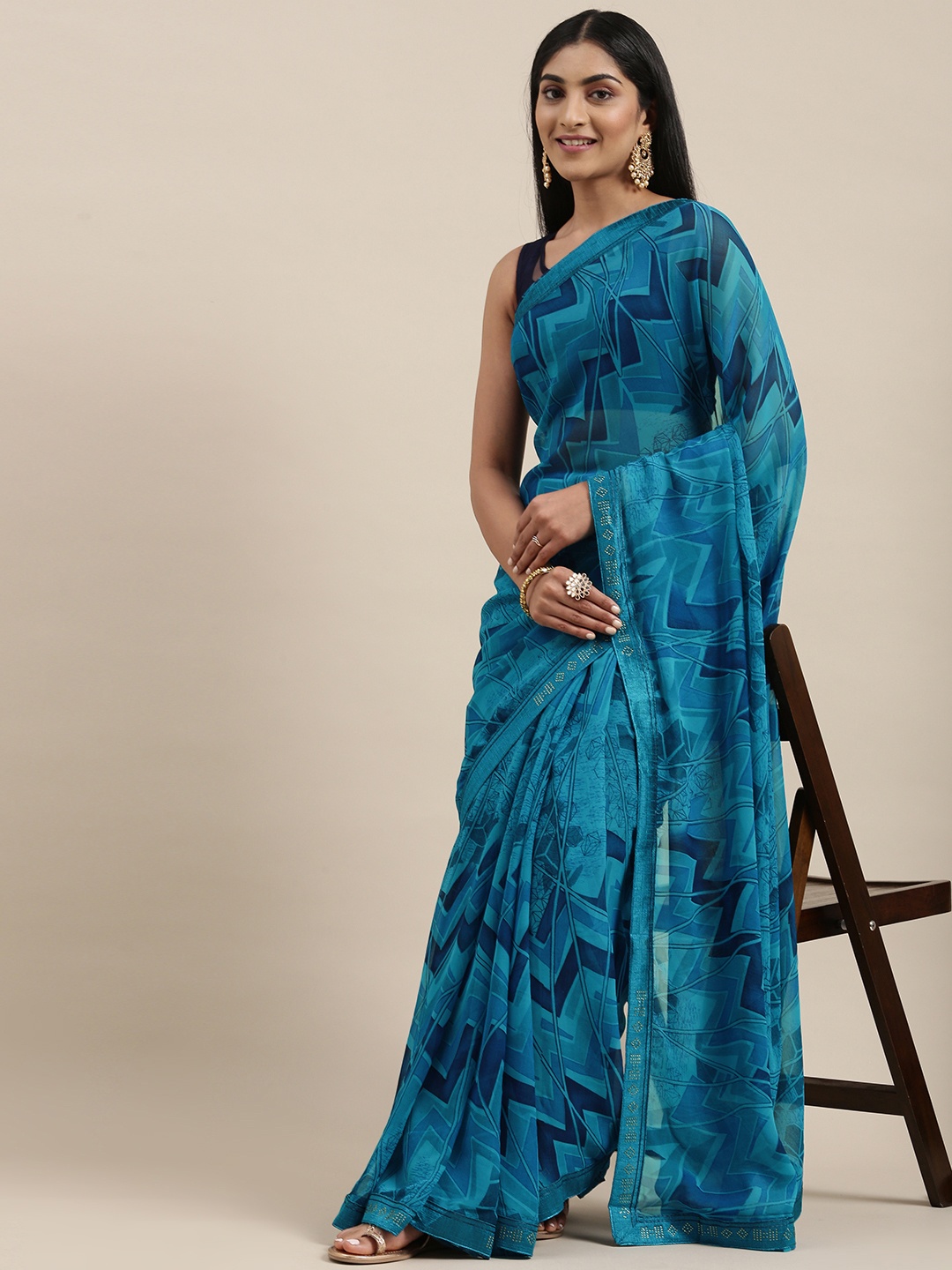 

Triveni Teal Green Printed Pure Georgette Saree