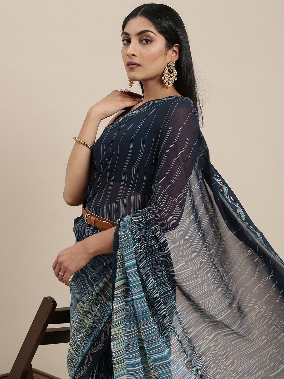 

Triveni Blue Striped Pure Georgette Saree