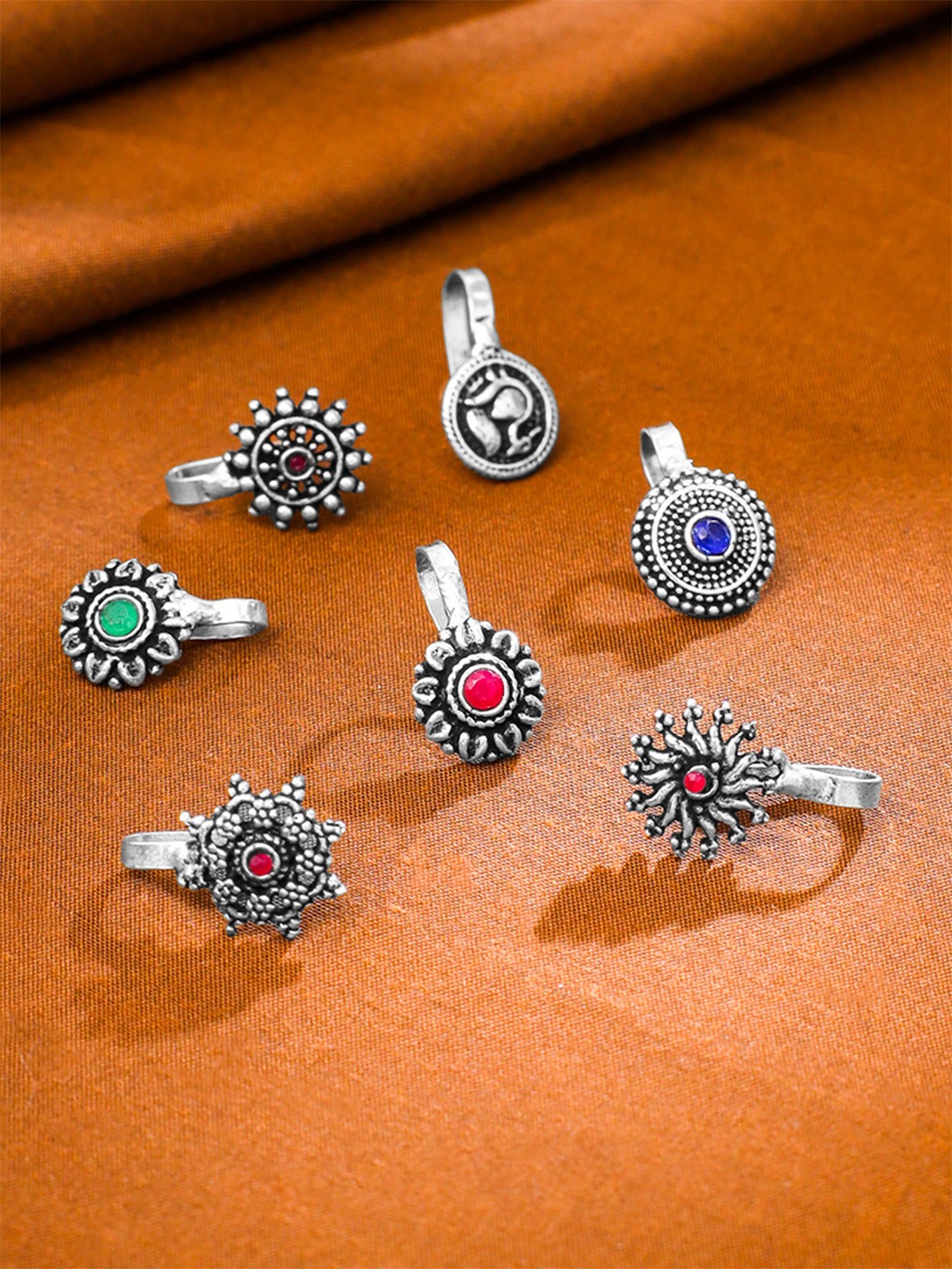 

Yellow Chimes Silver Toned Set Of 7 Oxidised Clip-On Nose Pins