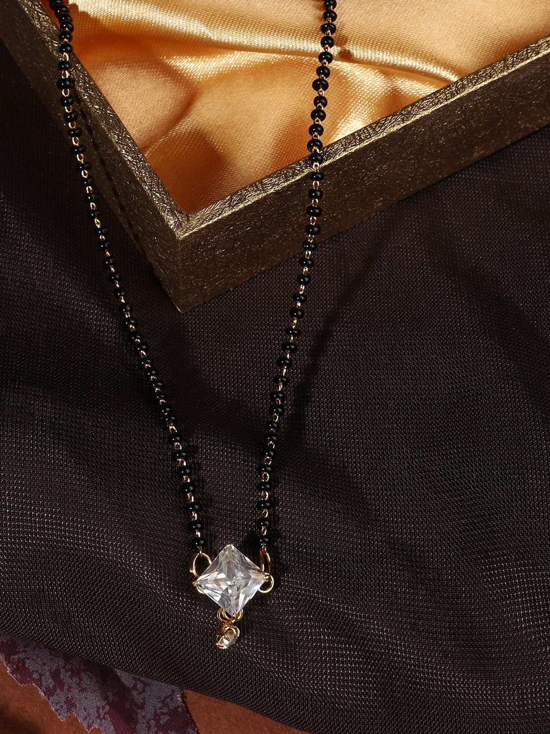 

ANIKAS CREATION Woman Gold-Plated Black &White Stone-Studded & Beaded Mangalsutra