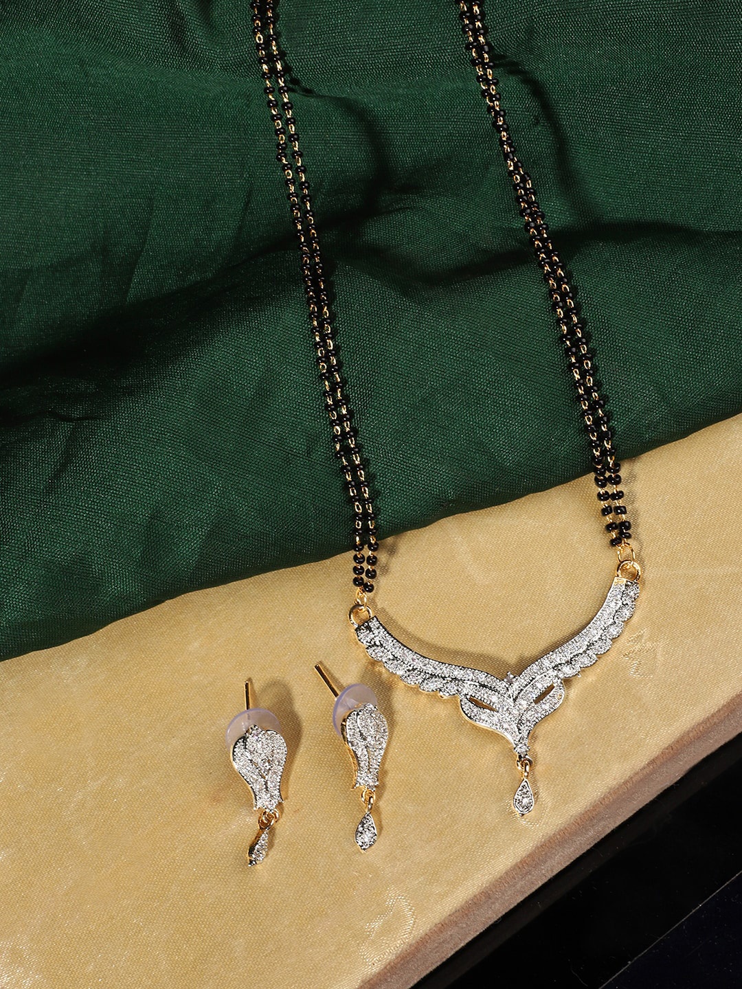 

ANIKAS CREATION Gold-Plated Black & White Mangalsutra With Earrings