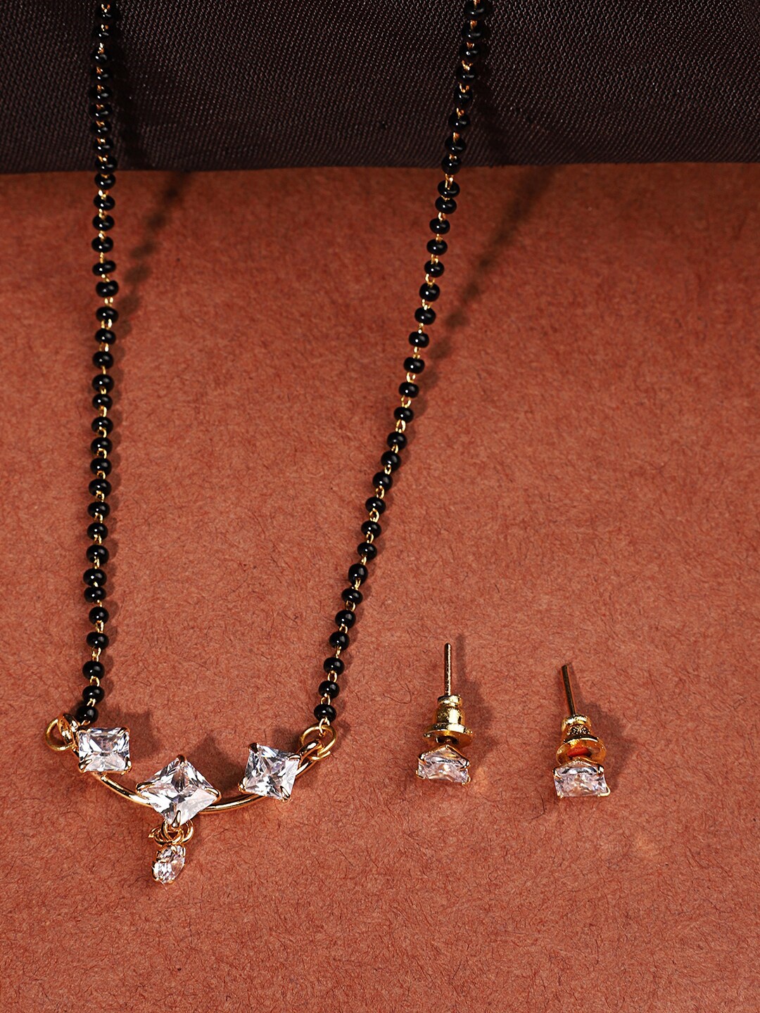 

ANIKAS CREATION White & Black Gold Plated Stone Studded & Beaded Mangalsutra Set