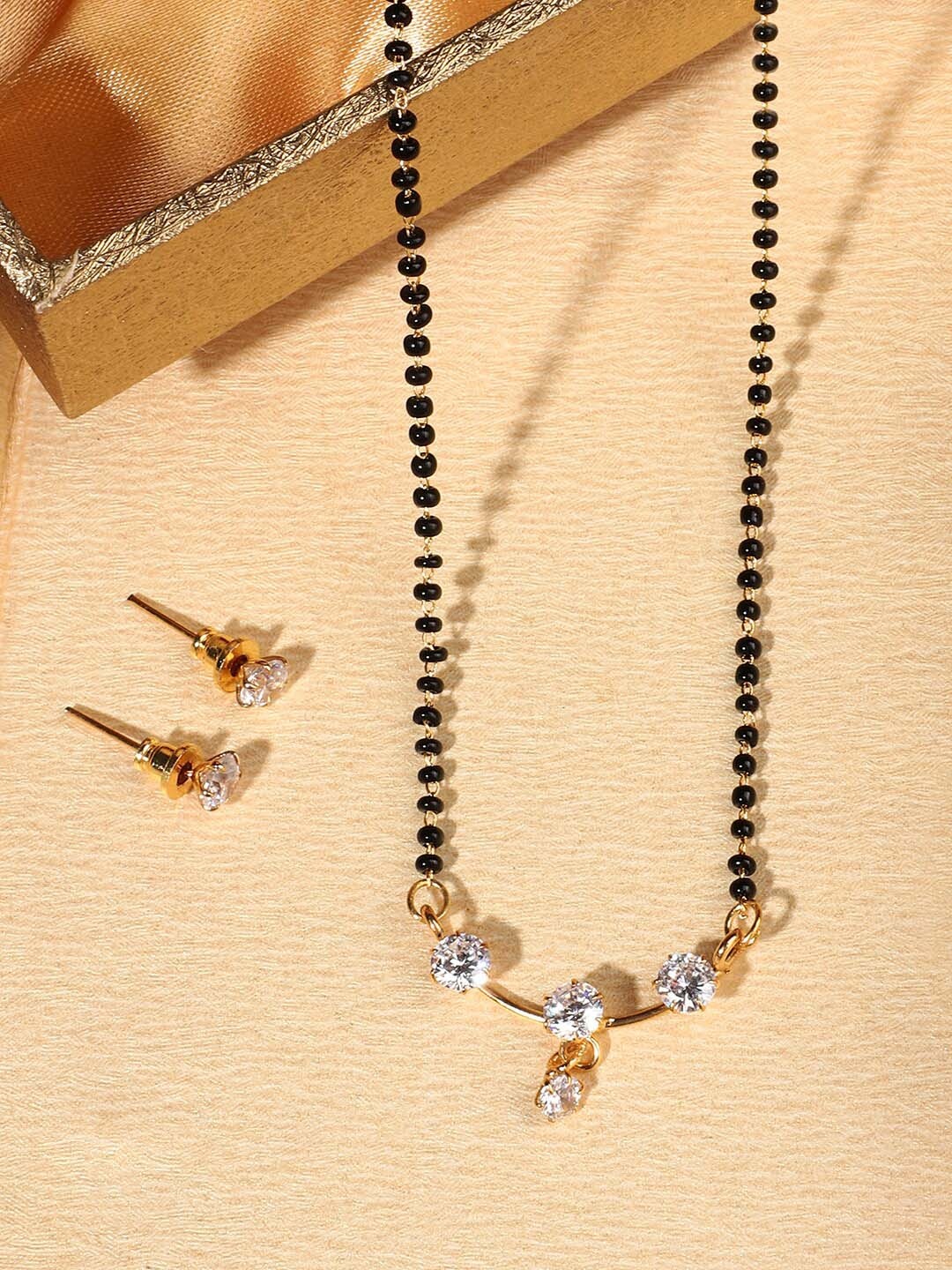 

ANIKAS CREATION Women White Stone-Studded & Beaded Mangalsutra With Earrings