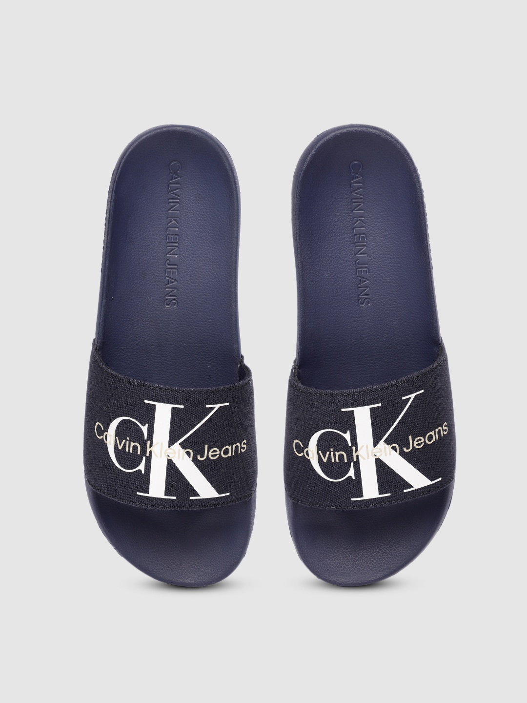 

Calvin Klein Men Navy Blue Fabric Printed Sliders